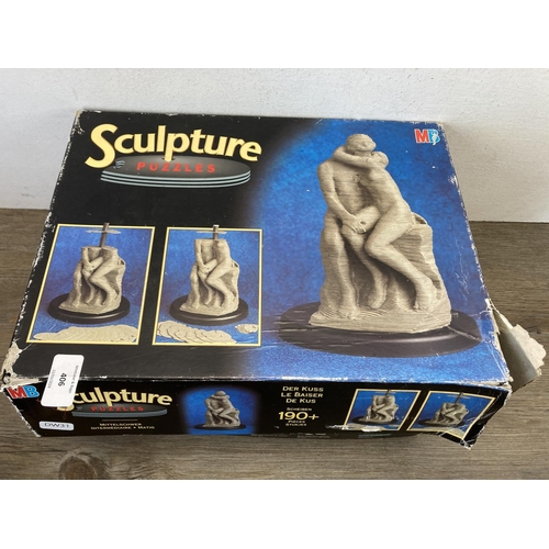 406 - Four boxed MB Sculpture Puzzles 3D vertical jigsaws