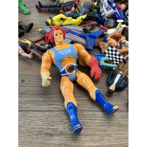 411 - A collection of action figurines and toys to include Playmobil, 1980s Mattel He-Man and Skeletor etc... 