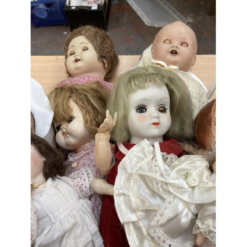 412 - A collection of porcelain and composition dolls to include Armand Marseille 518/5½K etc.