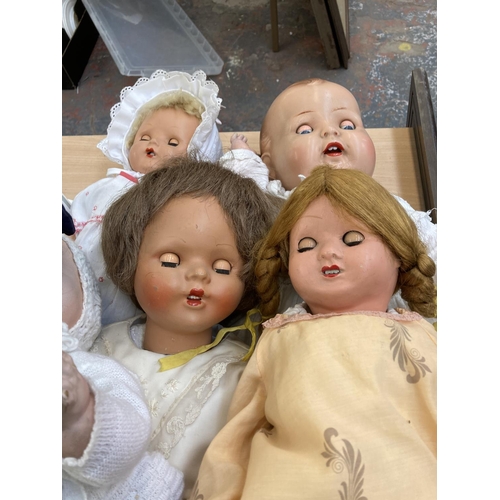 412 - A collection of porcelain and composition dolls to include Armand Marseille 518/5½K etc.