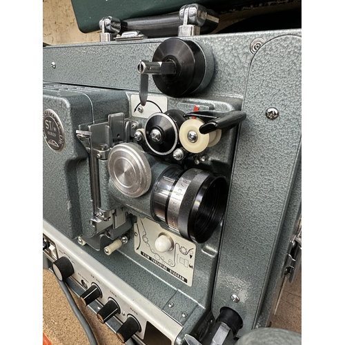 594 - An Eiki Industrial Co. Ltd. ST/M Series Elf M-2 16mm sound projector with Zeiss Ikon 16mm film rewin... 