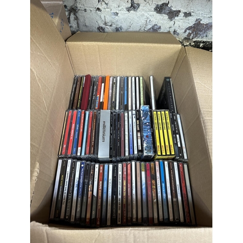 600 - Two boxes, one containing DVDs and one containing CDs