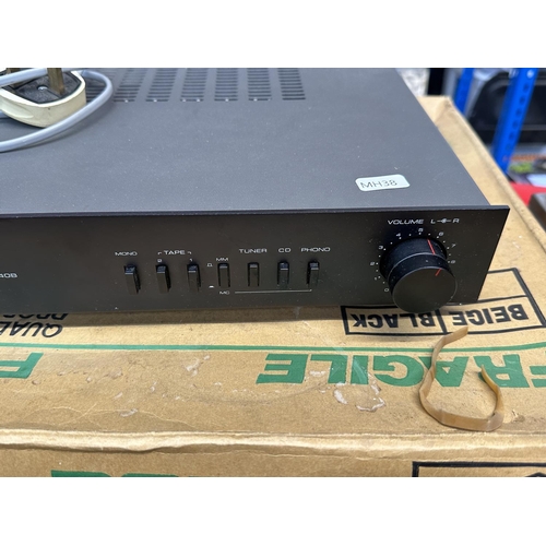 655 - A boxed Rotel RA-840B integrated stereo hi-fi amplifier