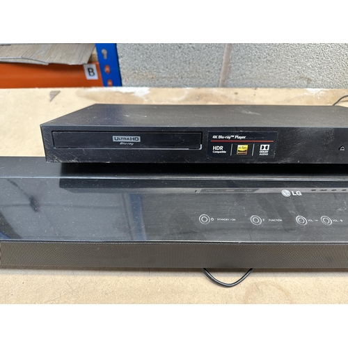 809 - Two LG items, one UBK80 4k Blu-ray player and one NB2520A soundbar