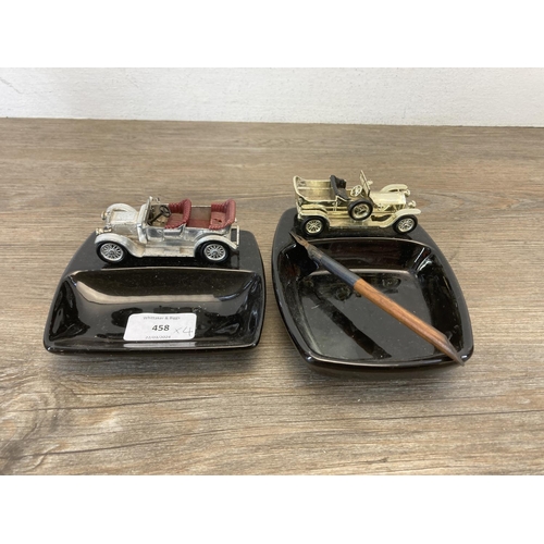 458 - Four desk accessories, two Lesney diecast model vehicle and ceramic ashtrays, one Arts and Crafts br... 