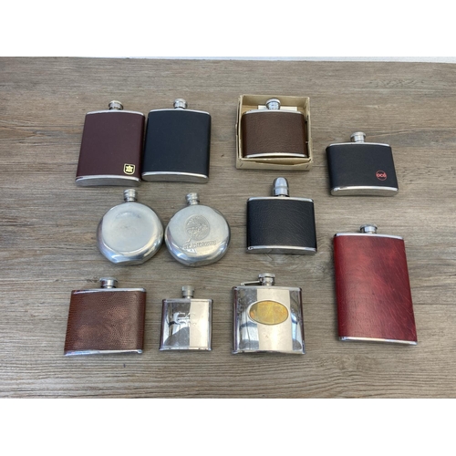 466 - A collection of hip flasks to include pewter, stainless steel etc.