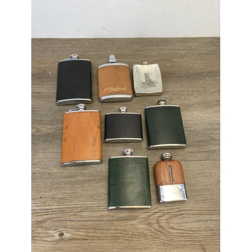 466 - A collection of hip flasks to include pewter, stainless steel etc.