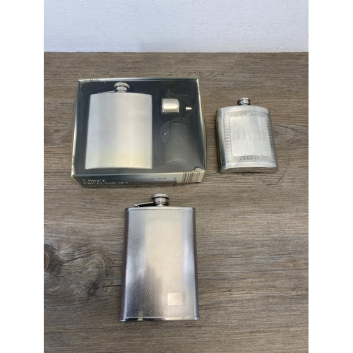 466 - A collection of hip flasks to include pewter, stainless steel etc.