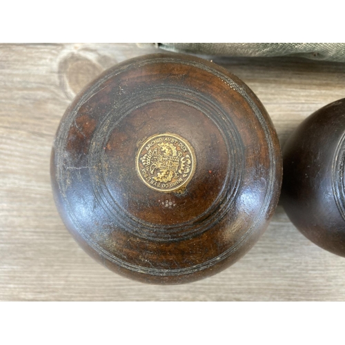 470 - A pair of late 19th/early 20th century Lignum Vitae crown green bowls with jack