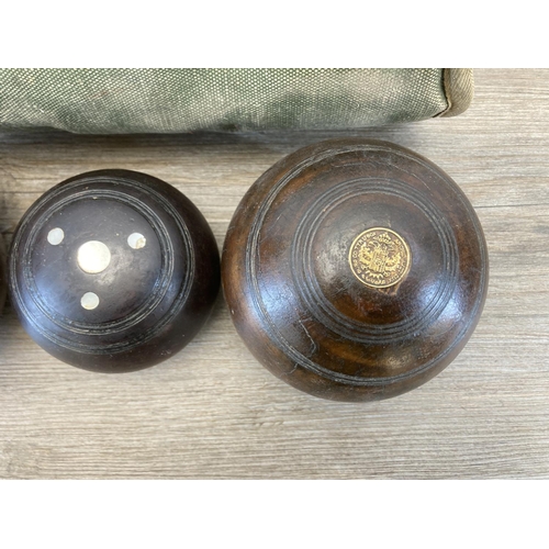 470 - A pair of late 19th/early 20th century Lignum Vitae crown green bowls with jack