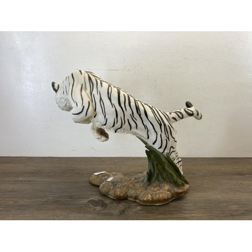 480 - A resin white tiger figurine - approx. 36cm high