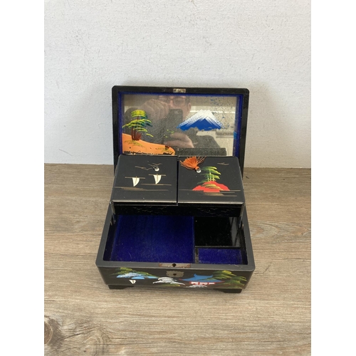 530 - Three mid 20th century hand painted black lacquer jewellery boxes with abalone shell inlay - largest... 