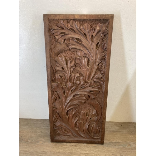 533 - A pair of carved oak wall plaques - approx. 60cm high x 27cm wide