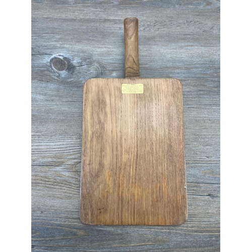 535 - A Bob 'Wren Man' Hunter carved oak cheeseboard - approx. 39cm long