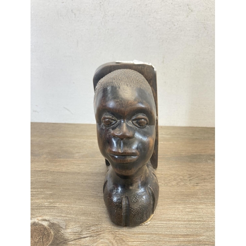 540 - An African carved hardwood bookend - approx. 18cm high