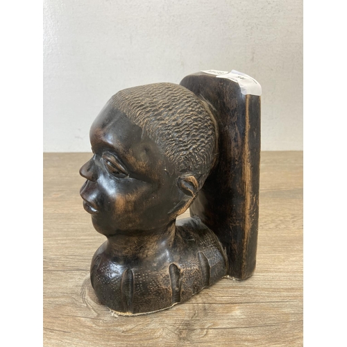 540 - An African carved hardwood bookend - approx. 18cm high