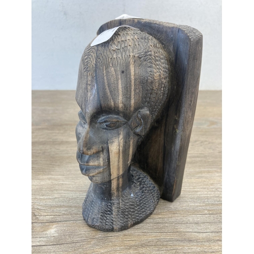 541 - A pair of African carved hardwood bookends - approx. 17cm high