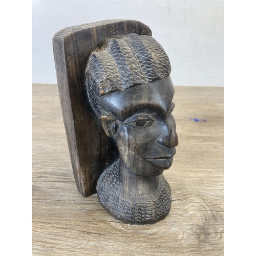 541 - A pair of African carved hardwood bookends - approx. 17cm high