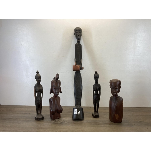 544 - Five African carved hardwood figurines - largest approx. 81cm long