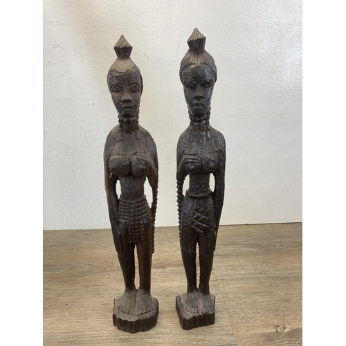 544 - Five African carved hardwood figurines - largest approx. 81cm long