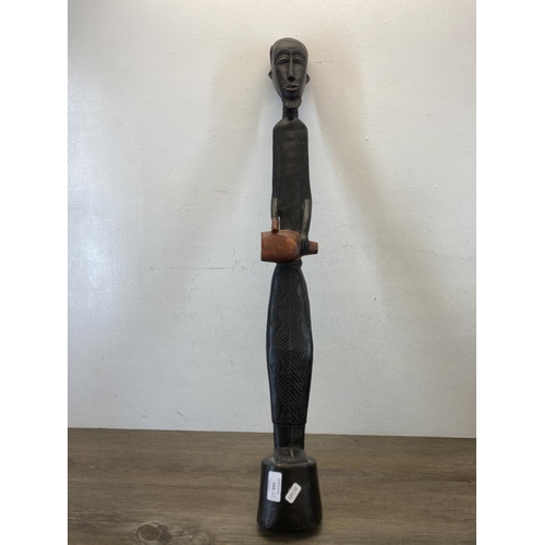 544 - Five African carved hardwood figurines - largest approx. 81cm long