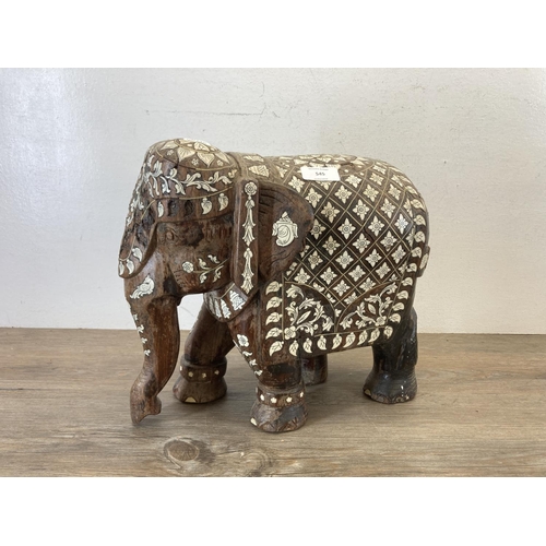 545 - A late 19th century Anglo Indian carved rosewood and bone inlaid elephant figurine - approx. 32cm hi... 