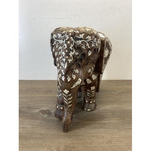 545 - A late 19th century Anglo Indian carved rosewood and bone inlaid elephant figurine - approx. 32cm hi... 