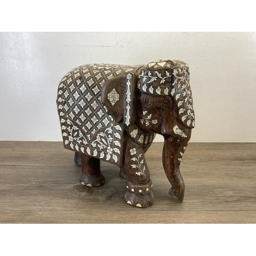 545 - A late 19th century Anglo Indian carved rosewood and bone inlaid elephant figurine - approx. 32cm hi... 