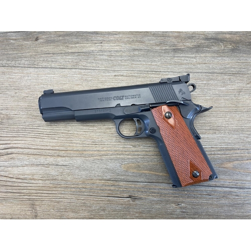 552 - A boxed Colt National Match M1911 full metal blow back system 6mm CO2 powered airsoft gun with acces... 