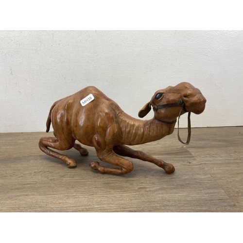 553 - Five Liberty style leather model camels - largest approx. 35cm high