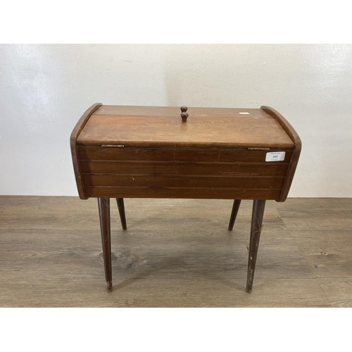 562 - A mid 20th century beech sewing box with contents - approx. 46cm high x 27cm wide x 46cm deep