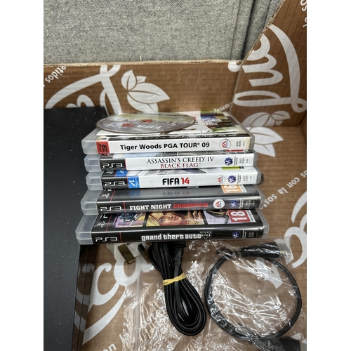 834 - A Sony PlayStation 3 Slim with games