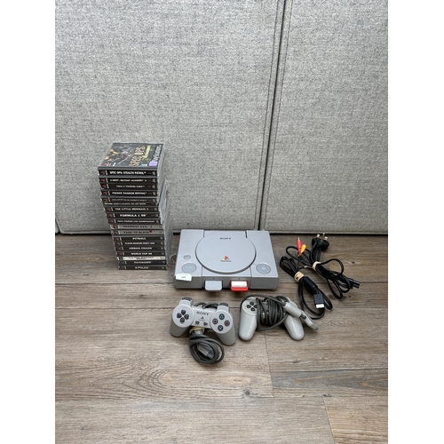 839 - A Sony PlayStation with games and accessories