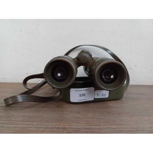 570 - A pair of Carl Zeiss Dialyt 8 x 30B safari green, rubber armoured binoculars with attached covers