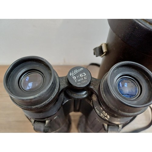 572 - A cased pair of Hilkinson 9 x 63 Field 6° armoured binoculars