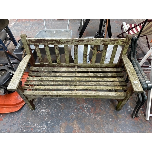 947 - A wooden garden bench