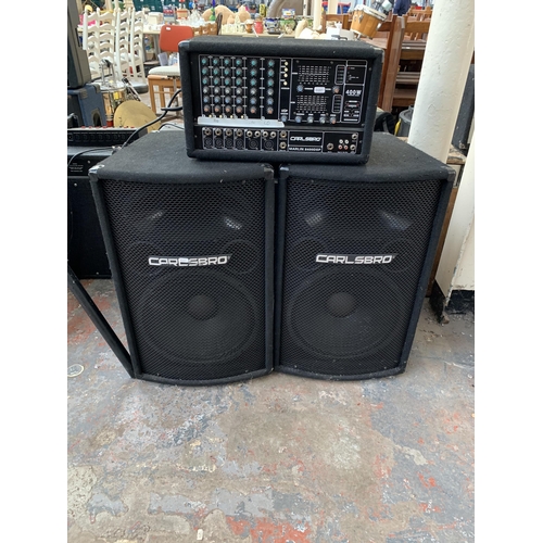 691 - A Carlsbro PA system comprising Marlin 8400DSP 400w powered mixer and a pair of D15 400w RMS 8Ω spea... 