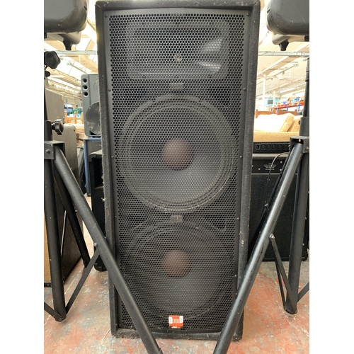 692 - Three JBL PA speakers, one pair of EON15 G2 powered with tripod stands and one JRX100 floor standing... 