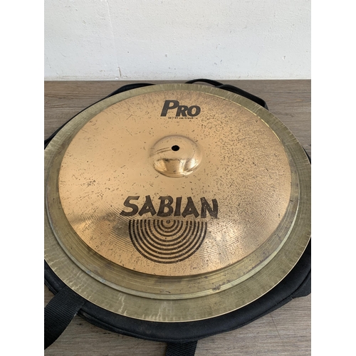 731 - A collection of various cymbals to include Sabian, Meinl, Paiste etc. together with Zildjian travel ... 