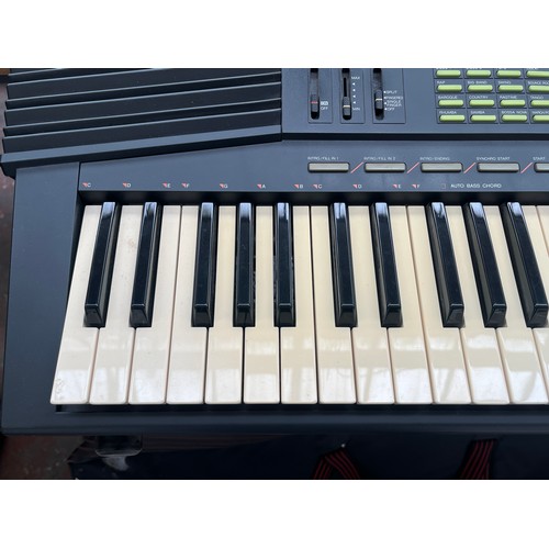 686 - A cased Yamaha PSR-38 electronic home keyboard with stand, boxed KPA-3 power supply and instruction ... 