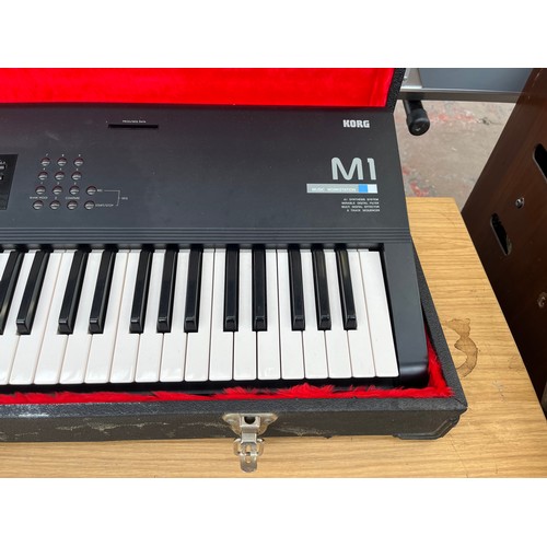 682 - A cased late 1980s/early 1990s Korg M1 61 key music workstation/synthesizer keyboard