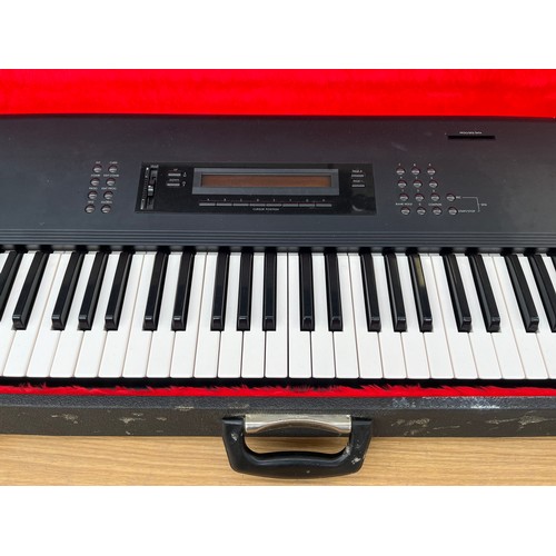 682 - A cased late 1980s/early 1990s Korg M1 61 key music workstation/synthesizer keyboard