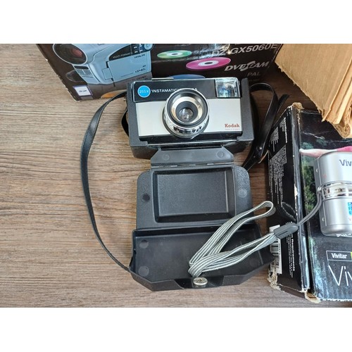 588 - A collection of photography equipment to include boxed Krokus 35 enlarger, boxed Hitachi DVD camcord... 