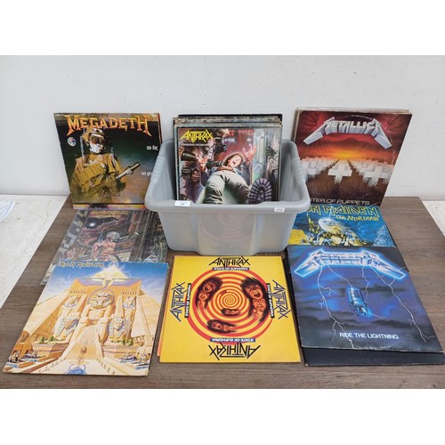 609 - A collection of rock vinyl records to include Metallica, Flotsam and Jetsam, Helloween, Megadeth, Ir... 