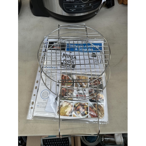 745 - A Ninja OP500UK air fryer and pressure cooker with cookbook and instruction manual