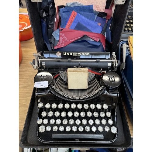 749 - Two cased vintage typewriters, one Underwood portable and one Remington Envoy III