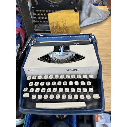 749 - Two cased vintage typewriters, one Underwood portable and one Remington Envoy III