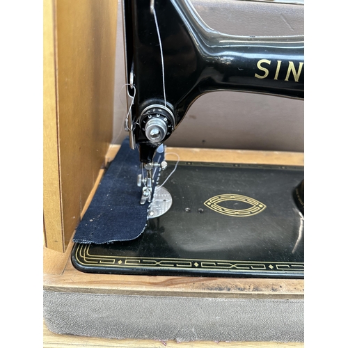 757 - A cased Singer 99K hand crank sewing machine