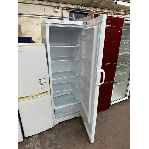 791 - An Indesit upright fridge - approx. 174cm high