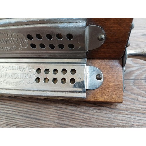 661 - A vintage three sided harmonica marked Wiemer Harmonika Concert